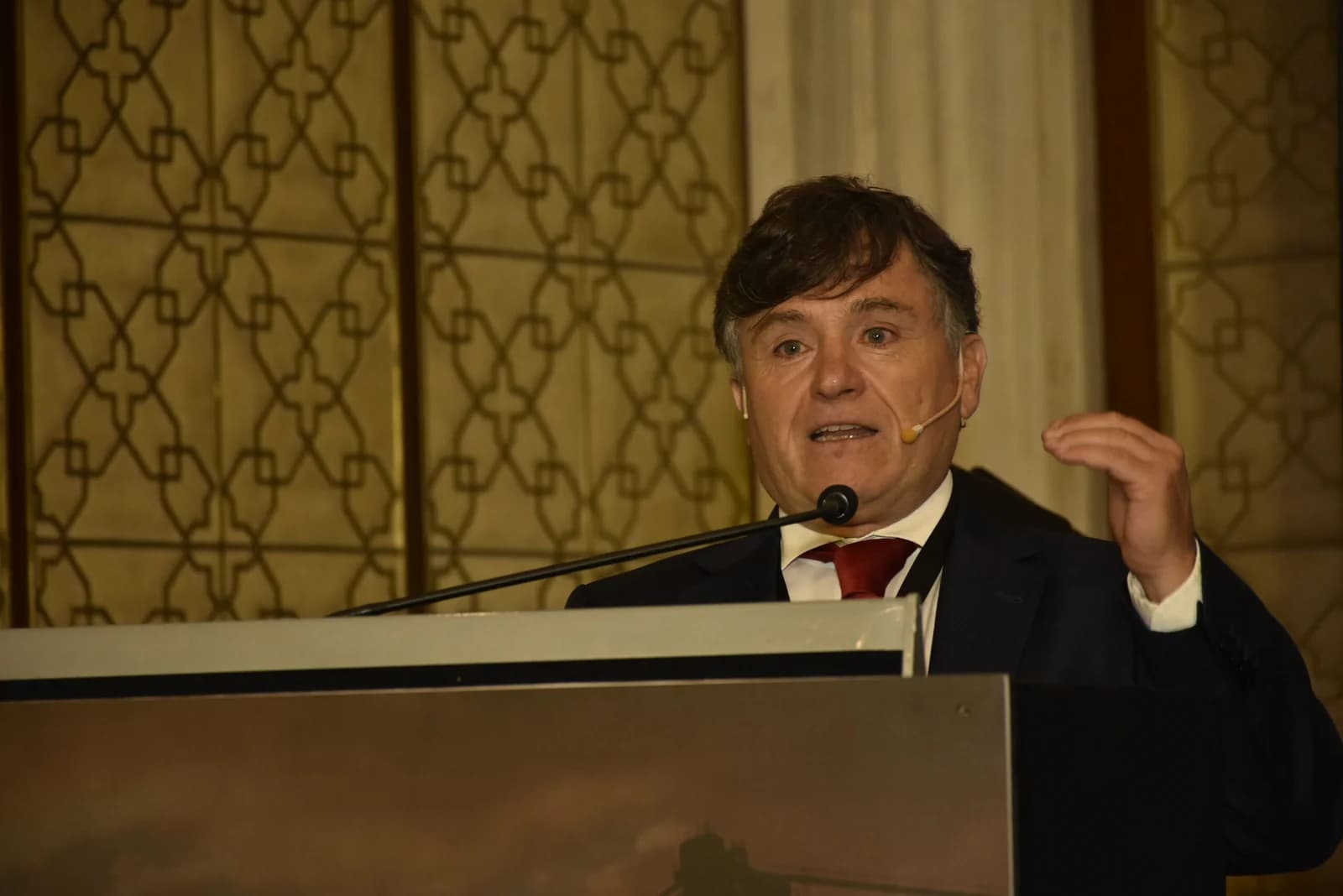 Conference speaker at podium 23