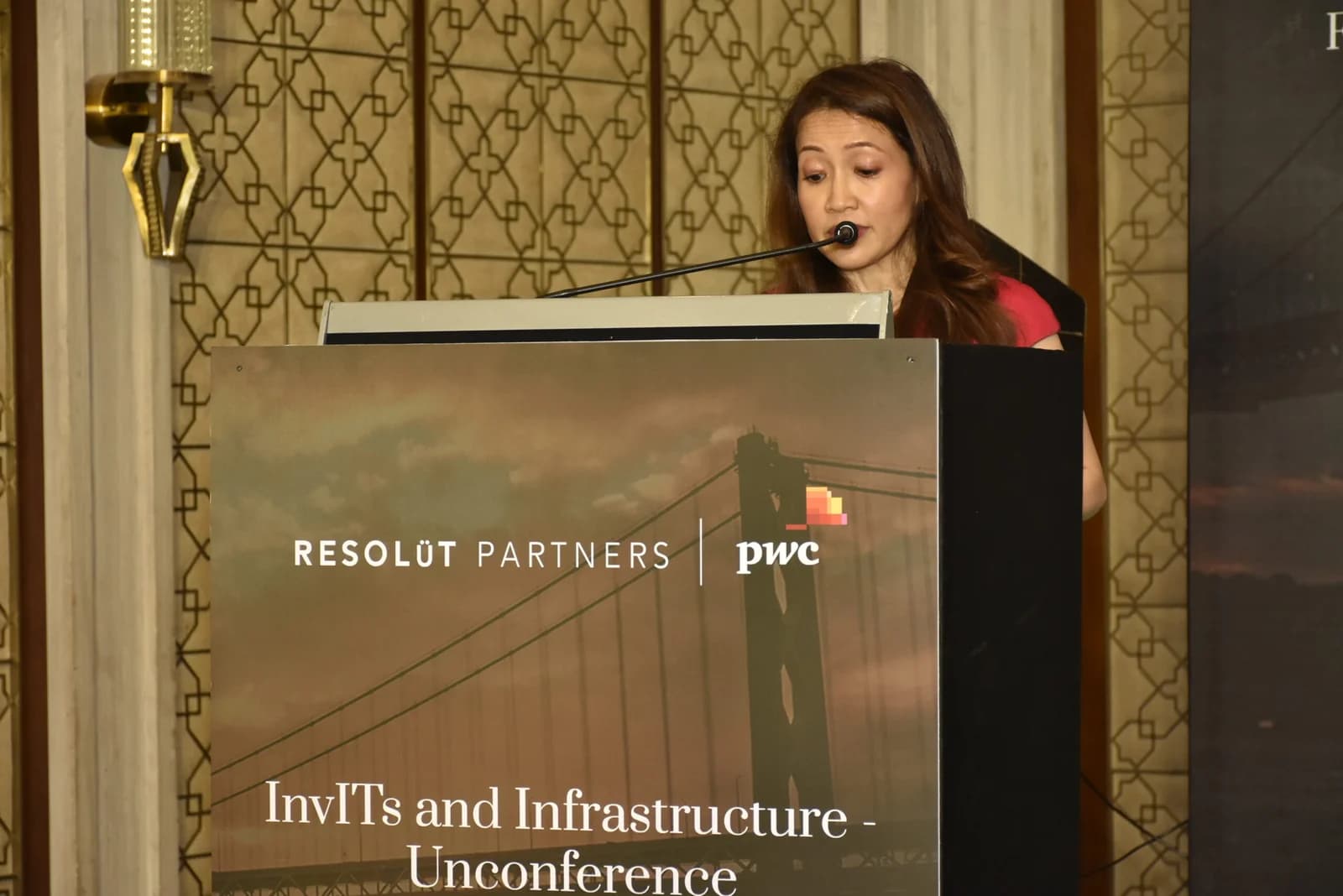 Conference speaker at podium 26