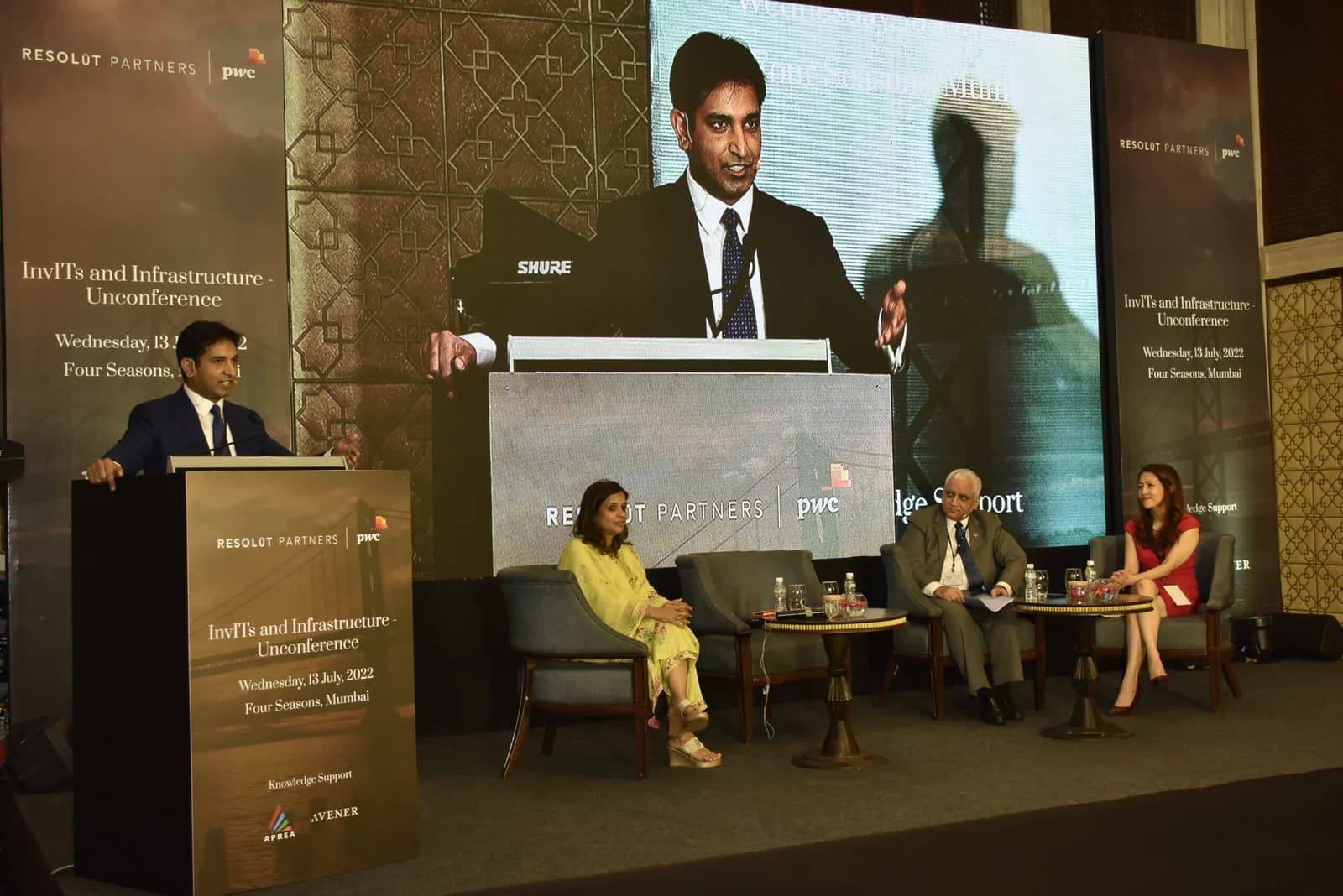 Conference speaker at podium 28