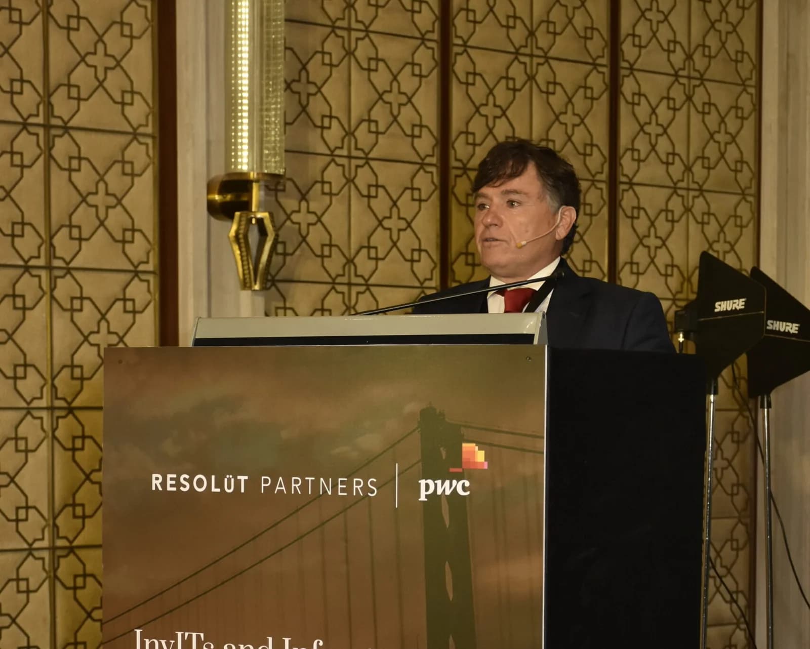 Conference speaker at podium 31