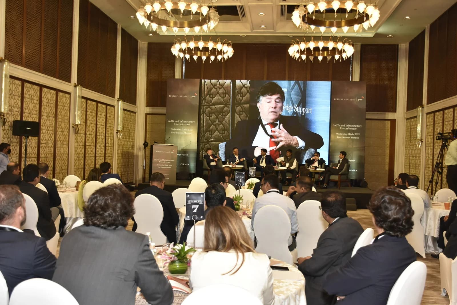 Conference speaker at podium 53