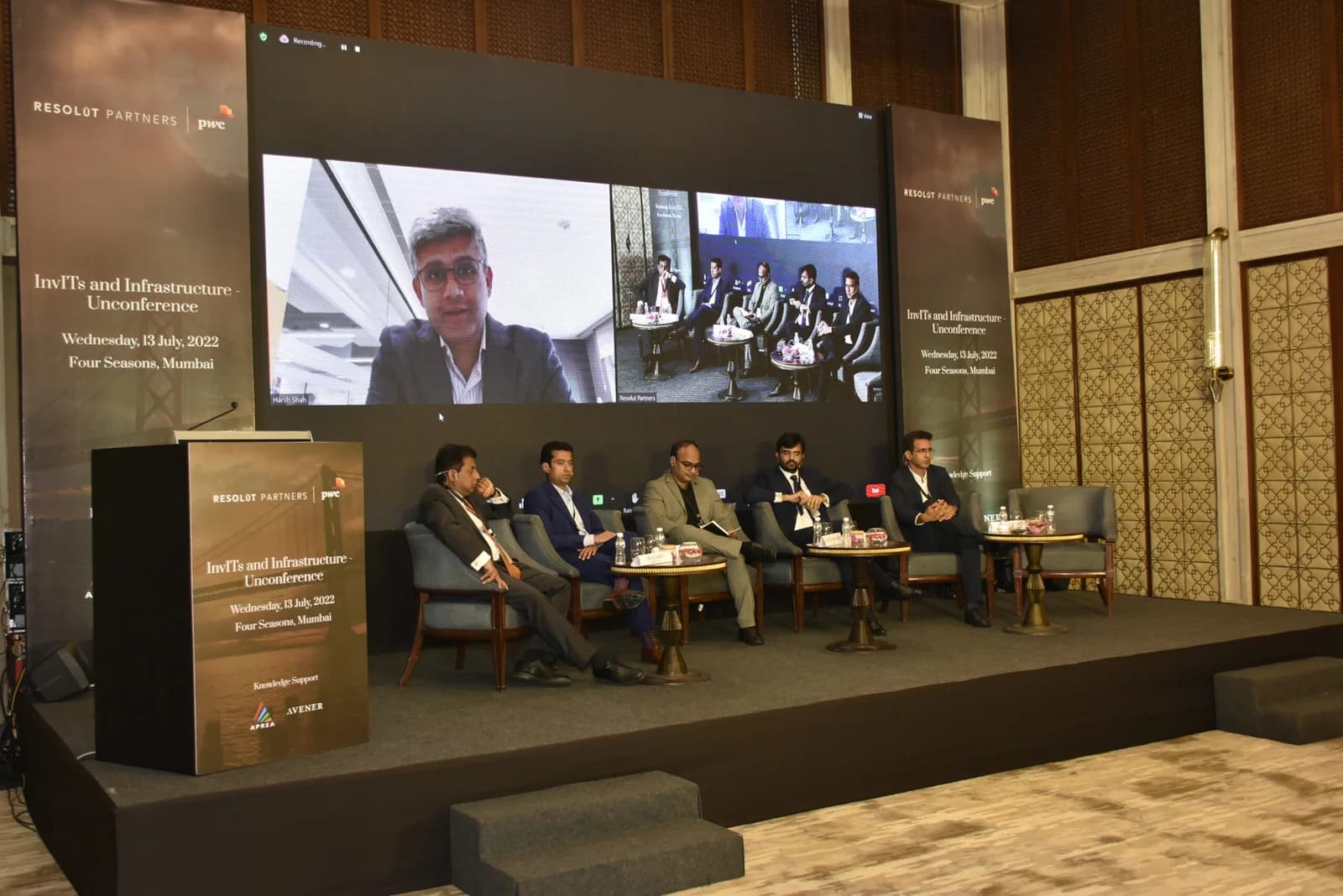 Conference speaker at podium 54