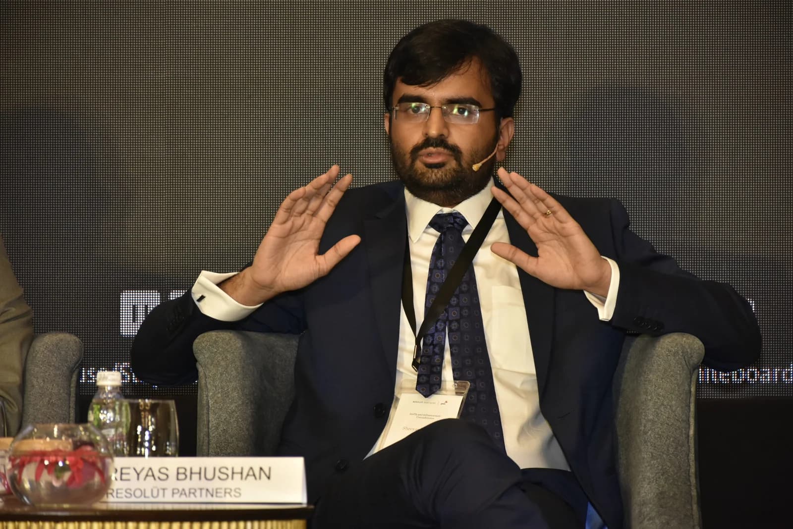 Conference speaker at podium 55