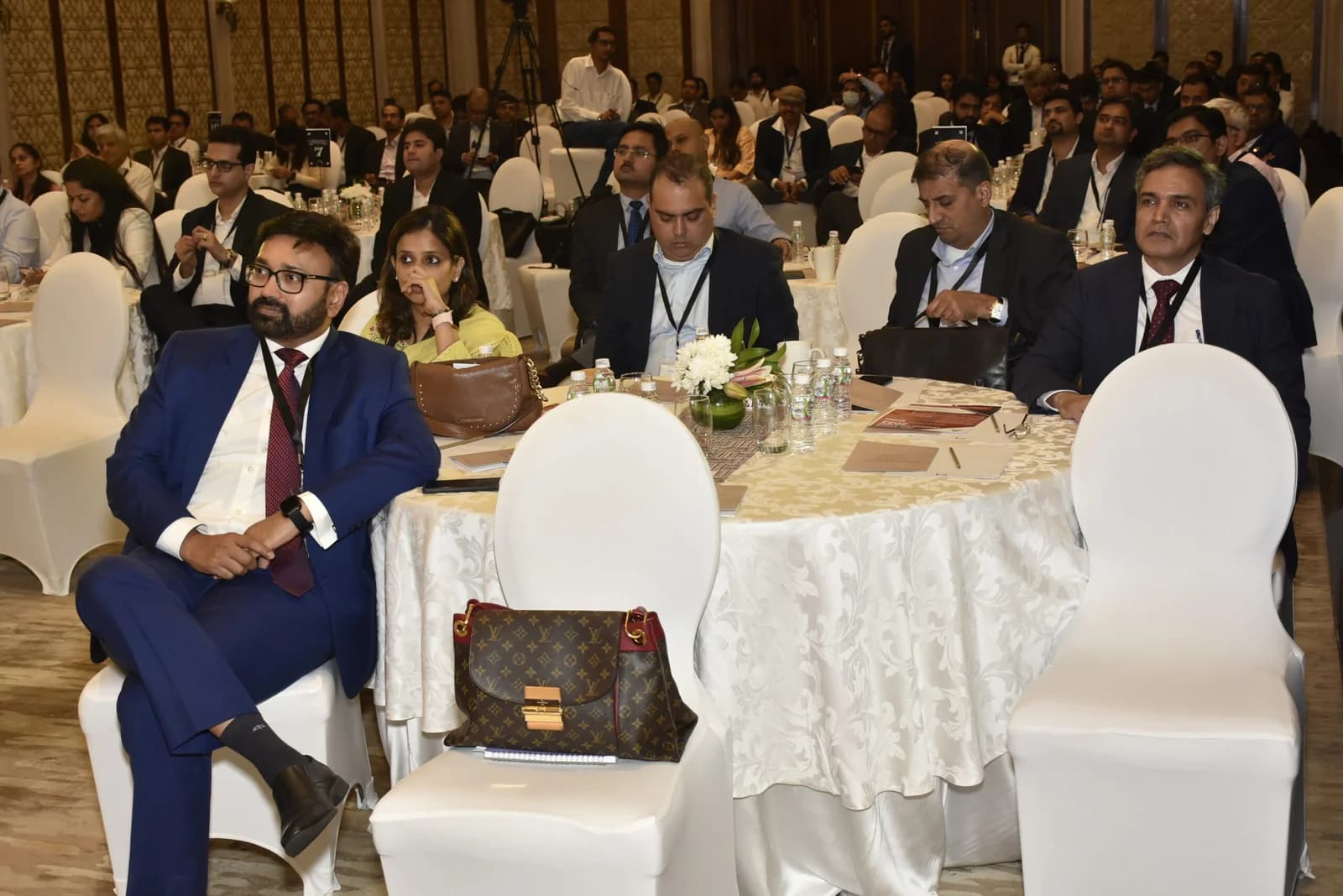 Conference speaker at podium 64