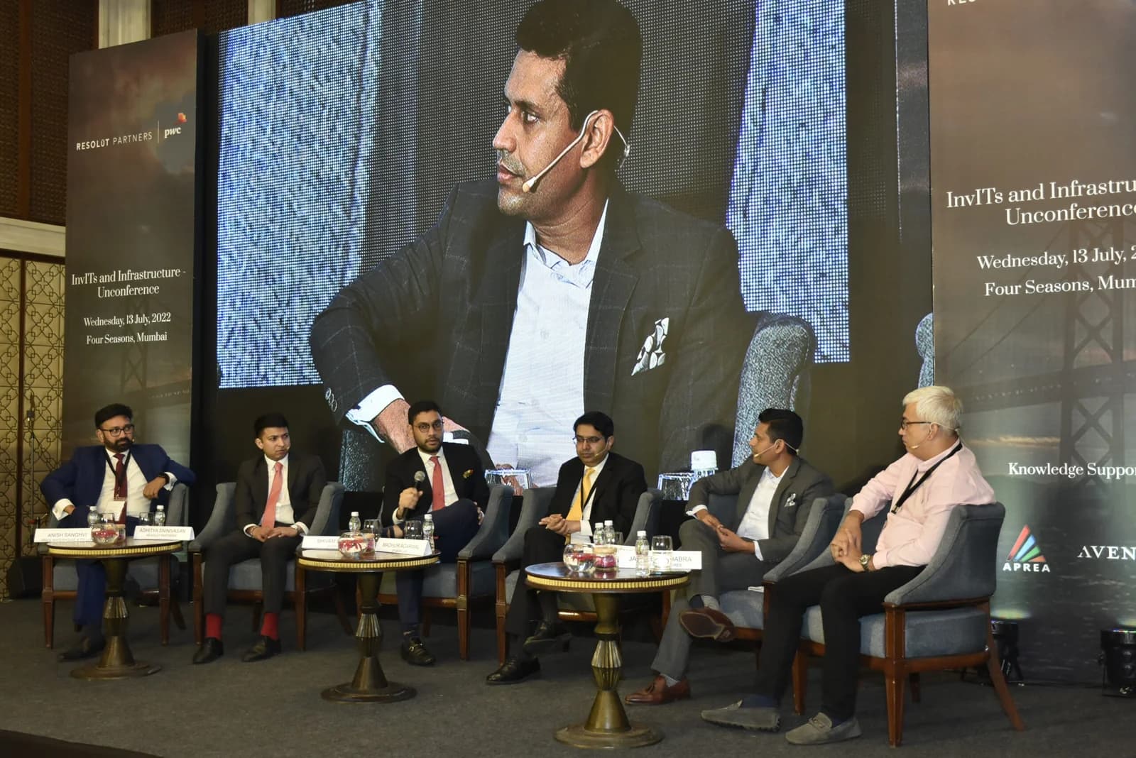 Conference speaker at podium 76