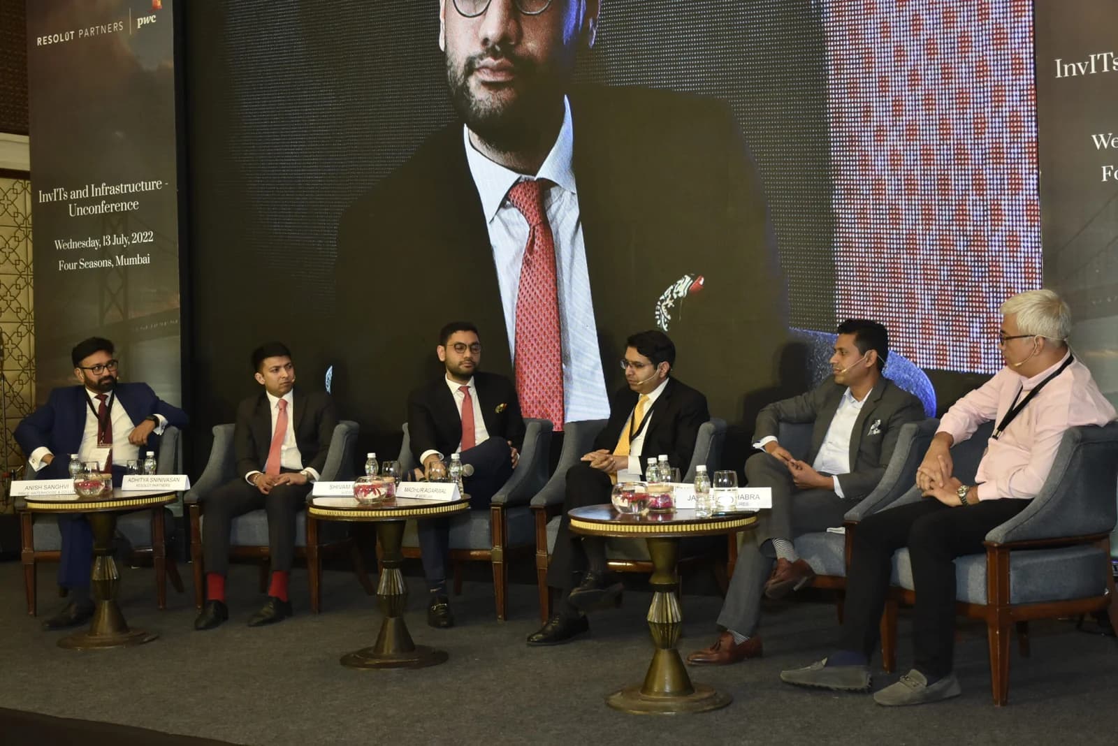 Conference speaker at podium 77