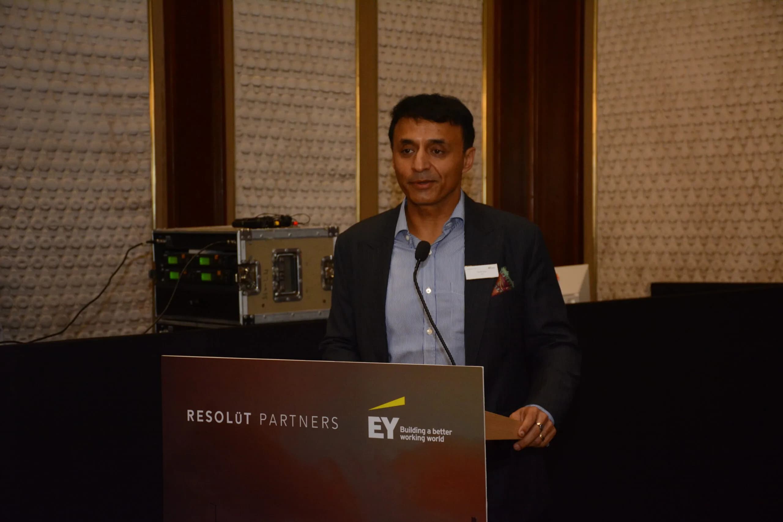 Conference speaker at podium 1