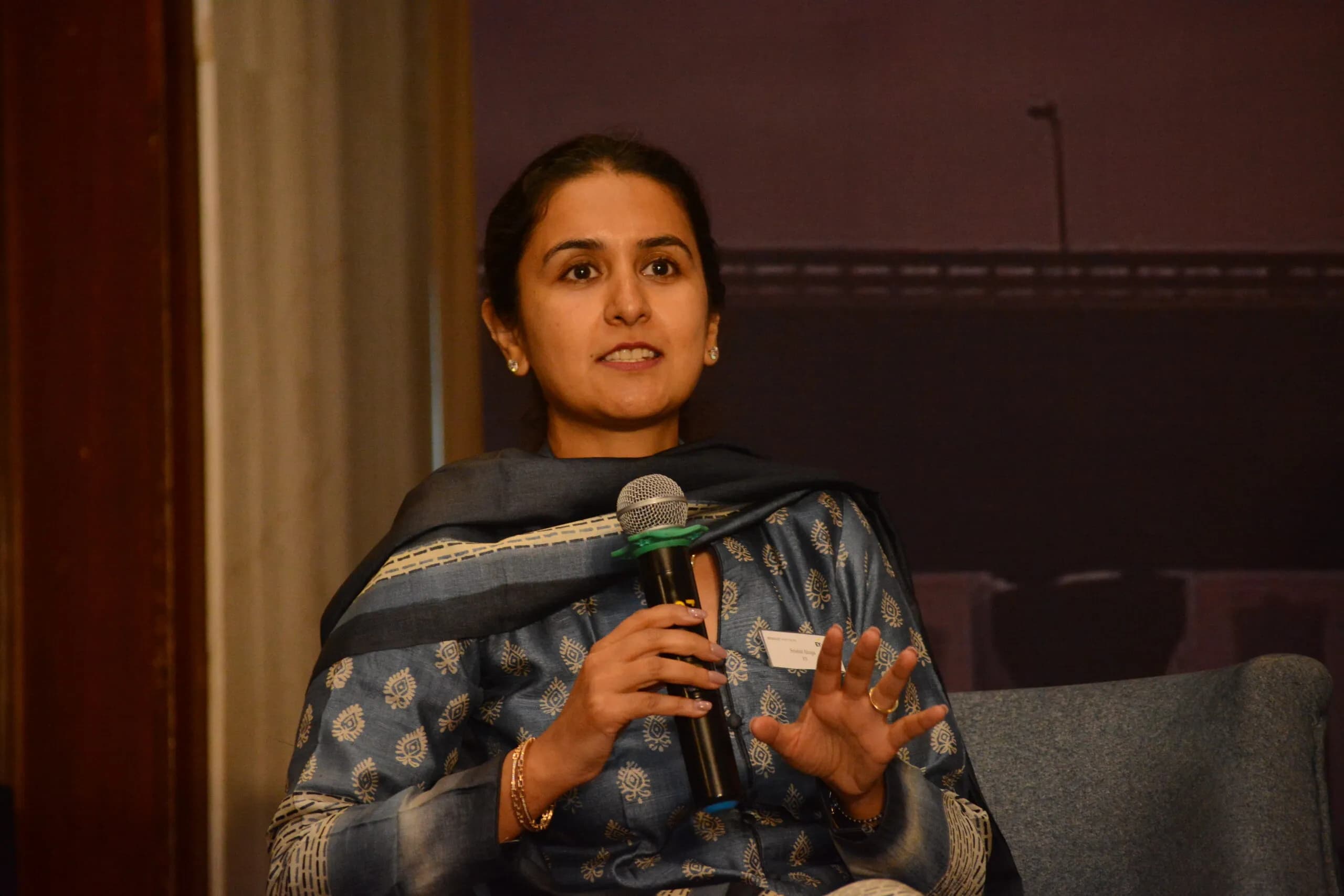 Conference speaker at podium 16